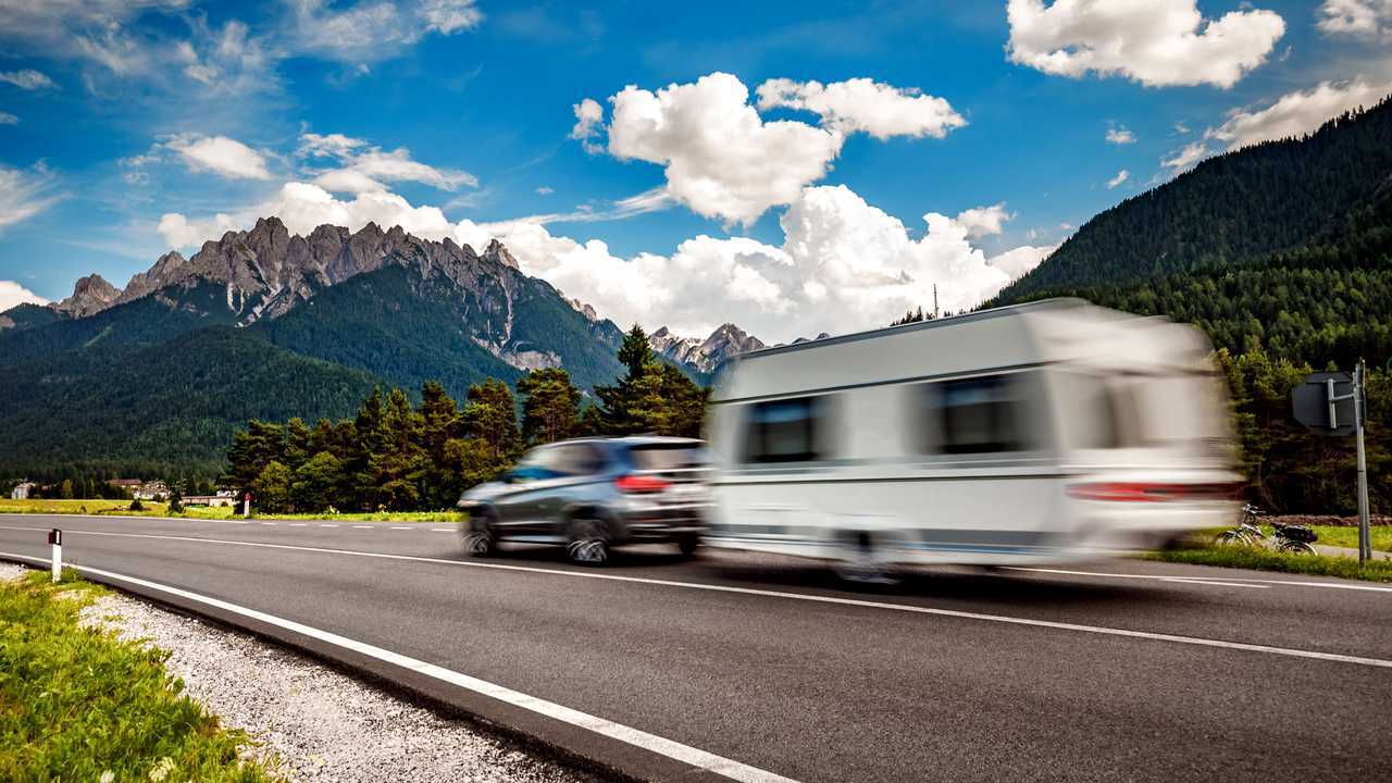 On the road with caravan in the Italian Alps