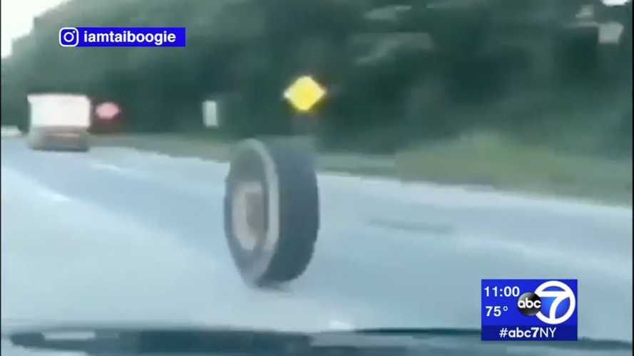 See a tipper lorry tyre roll down motorway and destroy a Jeep