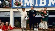 From left- Bruce McLaren, Henry Ford II and Chris Amon on the victory podium after the 1966 24 Hours of Le Mans