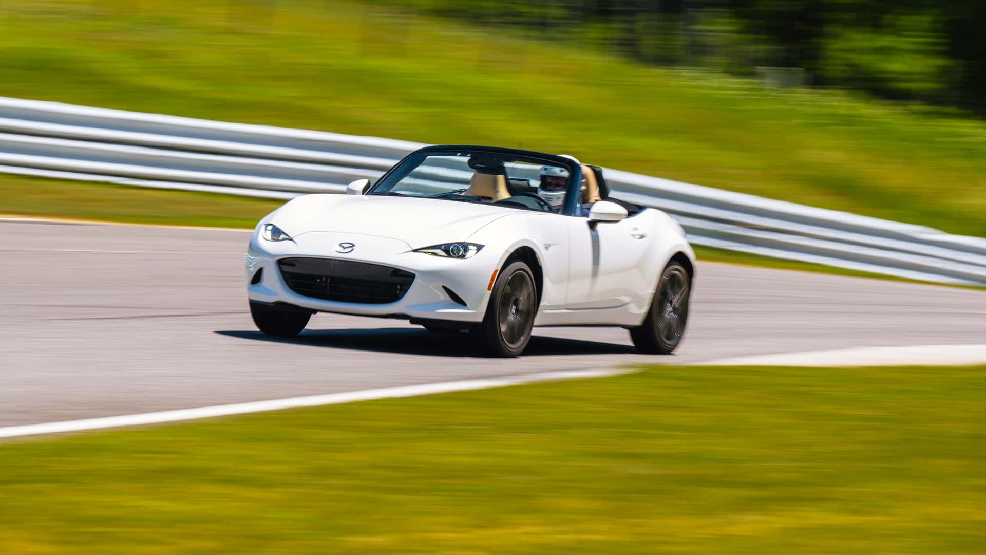 https://cdn.motor1.com/images/mgl/JOBm3E/s1/2024-mazda-mx-5-miata-grand-touring-review.jpg