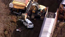 BMWs wrecked in train crash