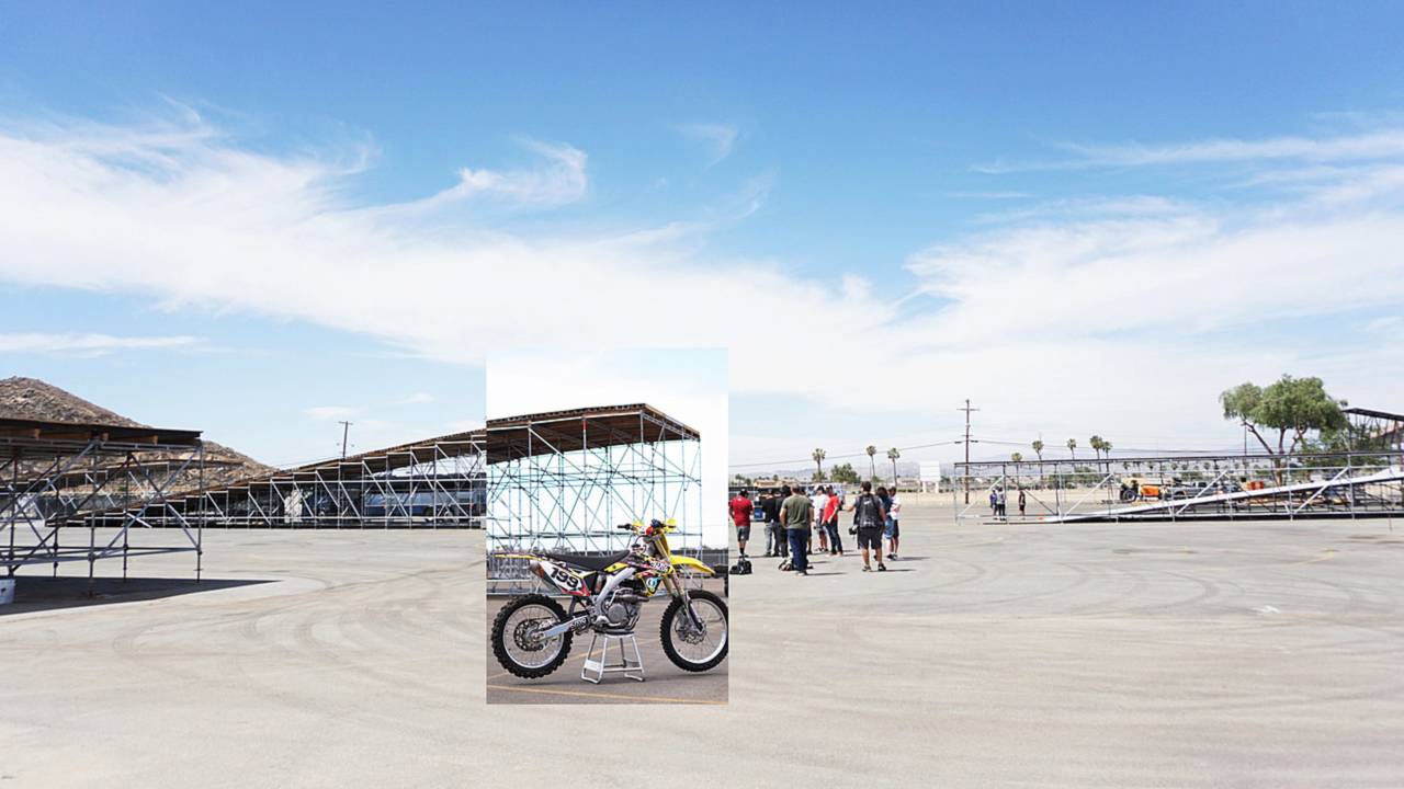 The testing grounds. Several ramps being constructed and Pastrana's Dirt bike.