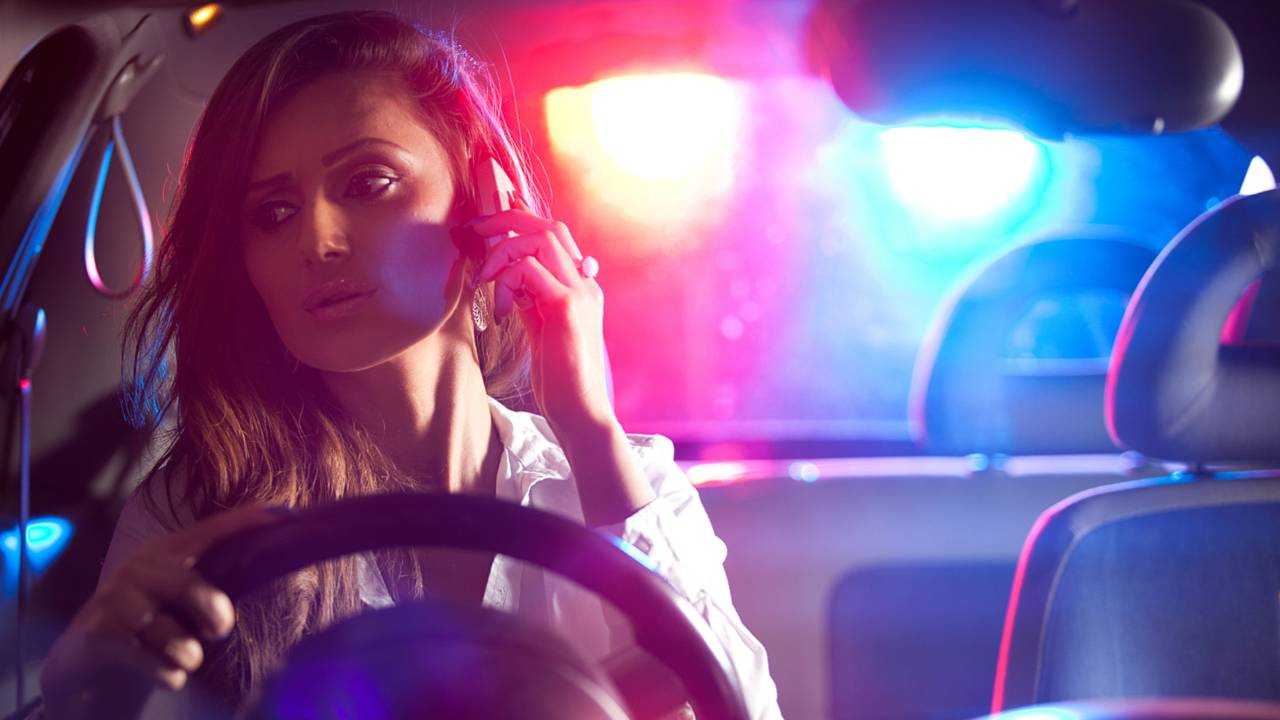 Woman on phone pulled over by police