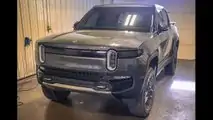 El Cap Granite Rivian R1T with tinted windows and front charging status LED bar