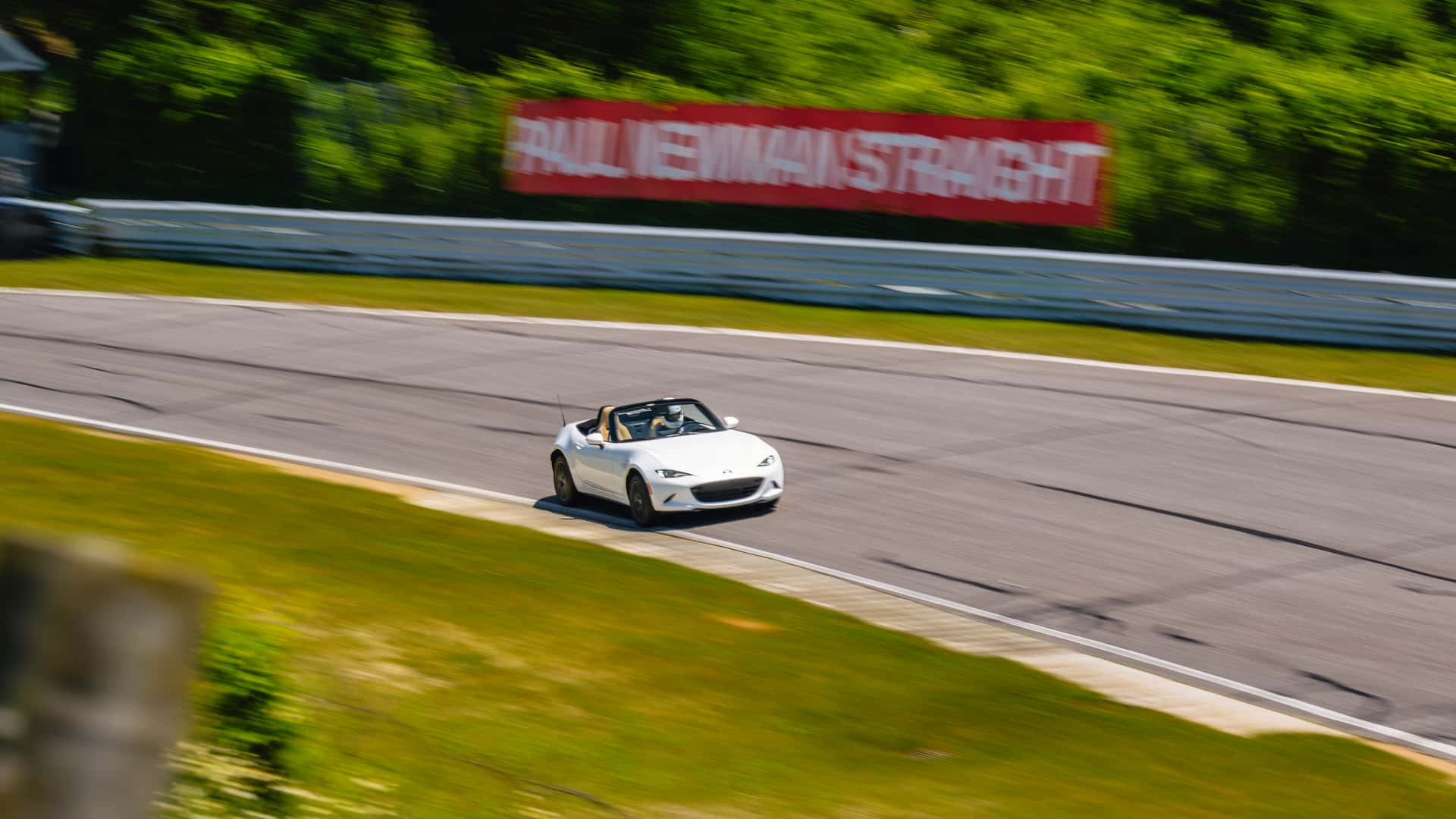https://cdn.motor1.com/images/mgl/L3k80G/s1/2024-mazda-mx-5-miata-grand-touring-review.jpg