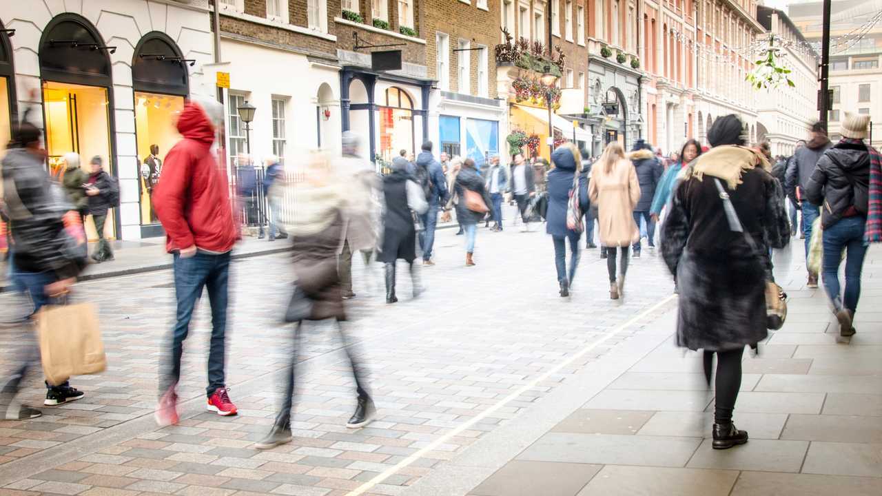 Busy high street with crowds of shoppers