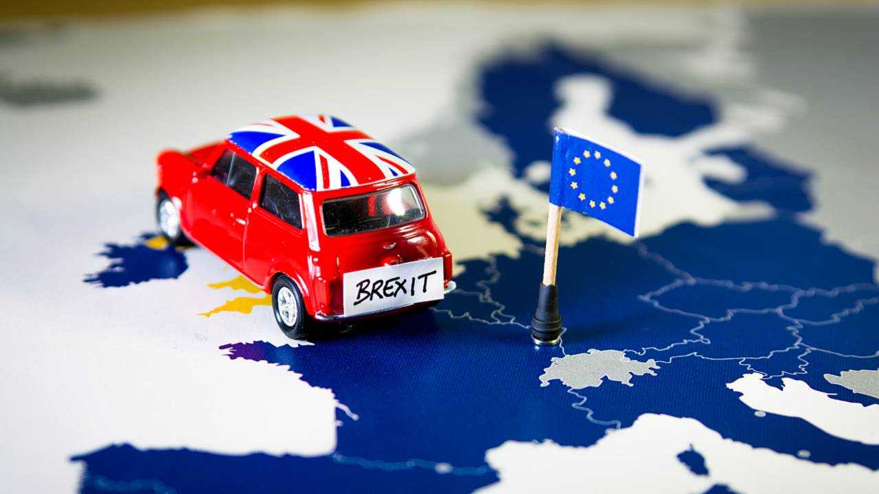 Mini Cooper over EU map symbolizing Brexit concept