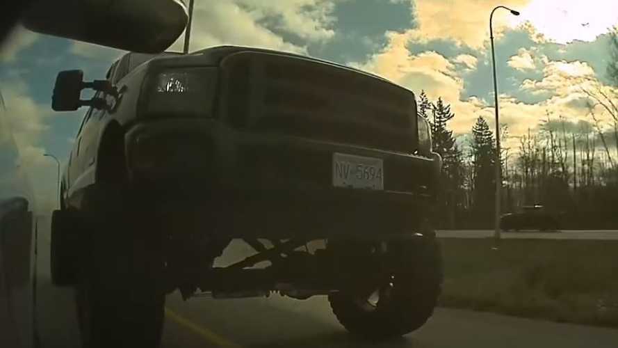 Watch Jacked-Up Ford Pickup Truck Try To Dangerously Pass A Tesla On The Shoulder