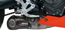 The Power Edition adds a factory Akrapovič exhaust system that drops a few pounds, bumps power slightly, and gives the parallel twin a much sharper soundtrack.