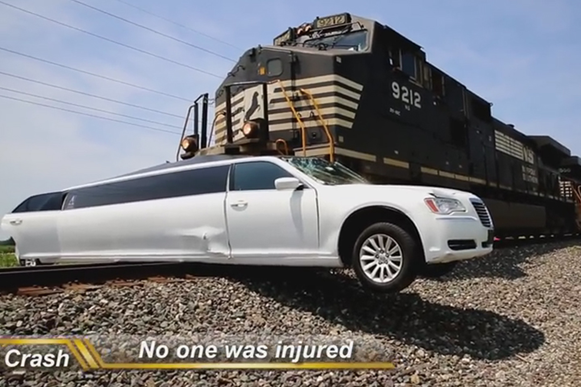 See Train Barrel into Limousine Stuck on the Tracks