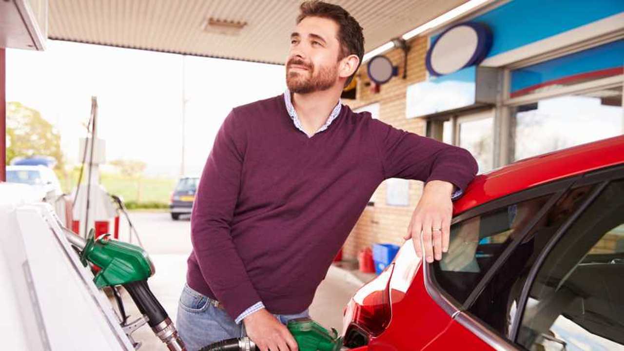 Man refuelling car at petrol station
