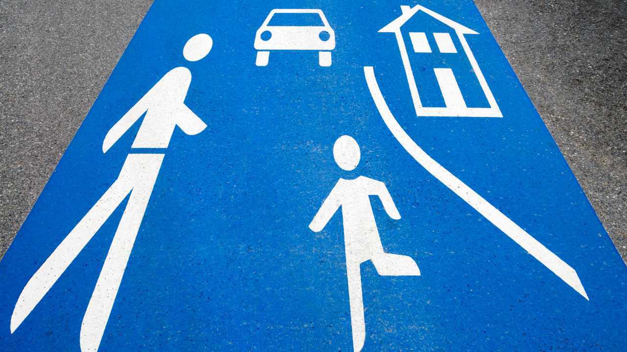 Play street symbol painted on asphalt