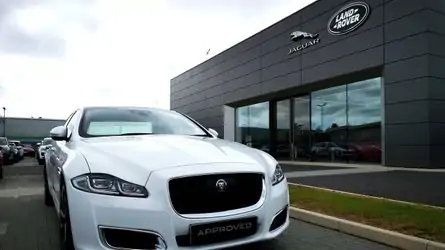 Used car market sees post-lockdown surge, web searches suggest Used Jaguar XJ outside Jaguar Land Rover showroom in Cardiff