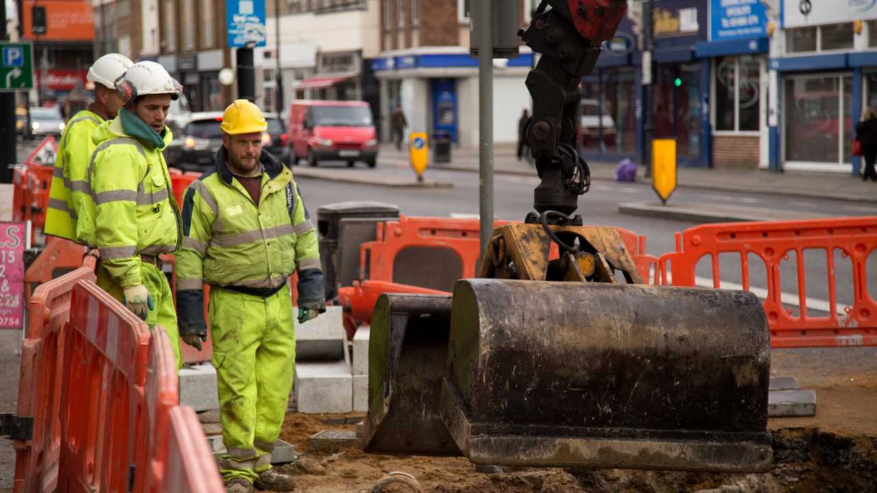 Loughlin labourers repaving the street in London