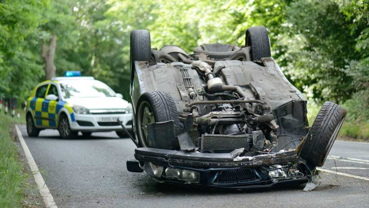 Police car closes road where vehicle flipped onto roof Shropshire