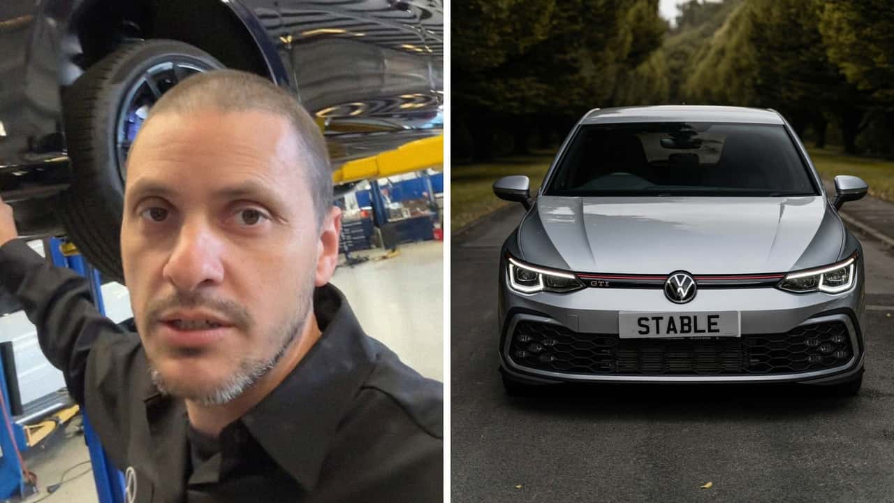 Mechanic works on customer's Volkswagen Golf