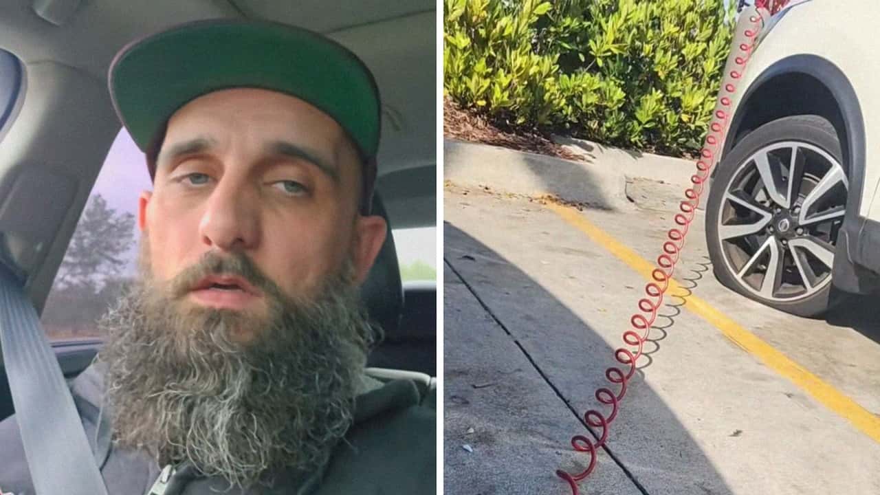 Nissan driver asks man for help