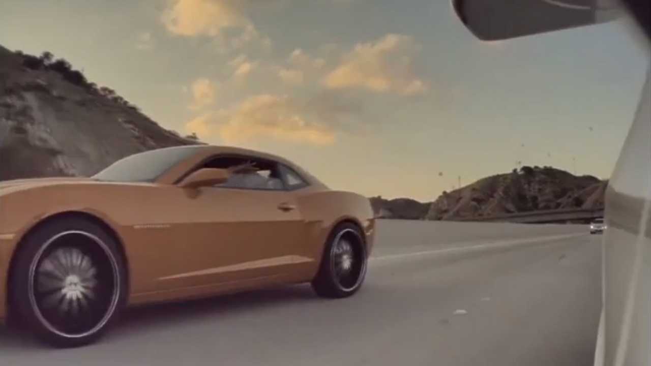 See This Camaro Driver Throw A Bunch Of Coins In a Tesla Model 3