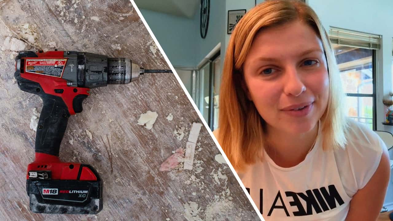Woman discovers someone drilled a hole in her car overnight.