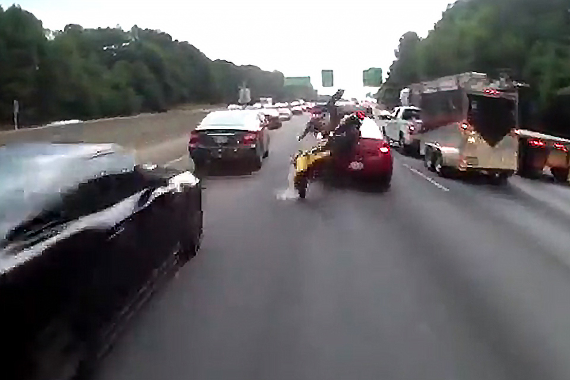 Watch This Lane Splitting End in Horrific Crash