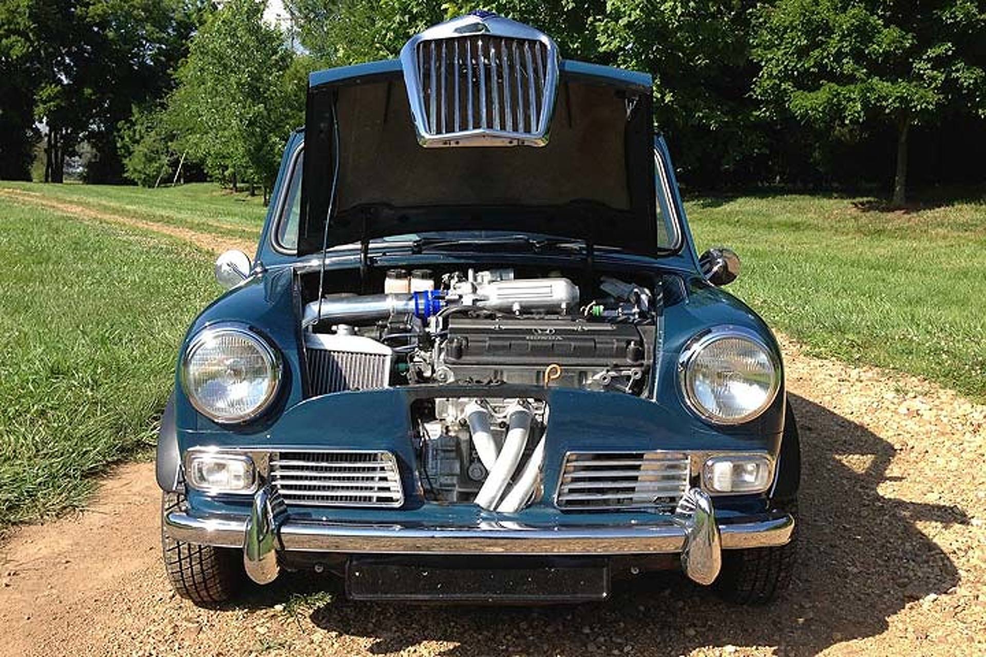 This Dainty British Sedan Hides a Honda VTEC Secret
