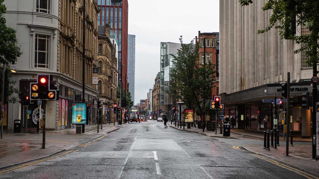 Deansgate Manchester UK quiet roads with few people