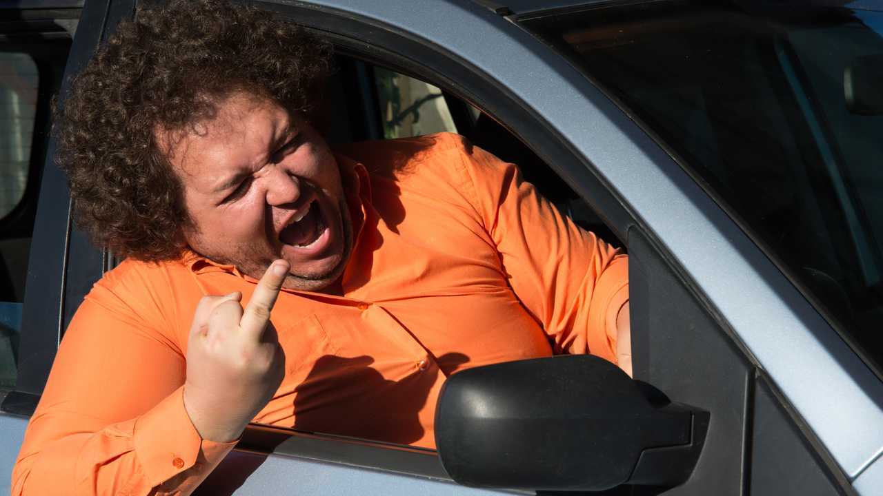 Angry driver man giving the middle finger