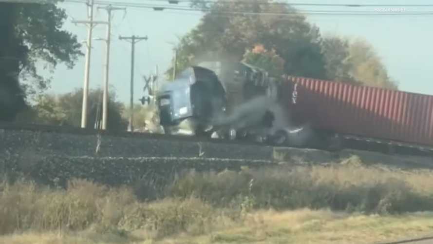 Freight train completely demolishes lorry stuck on tracks