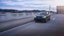 2023 Volkswagen ID.4 exterior front three-quarter view driving on bridge
