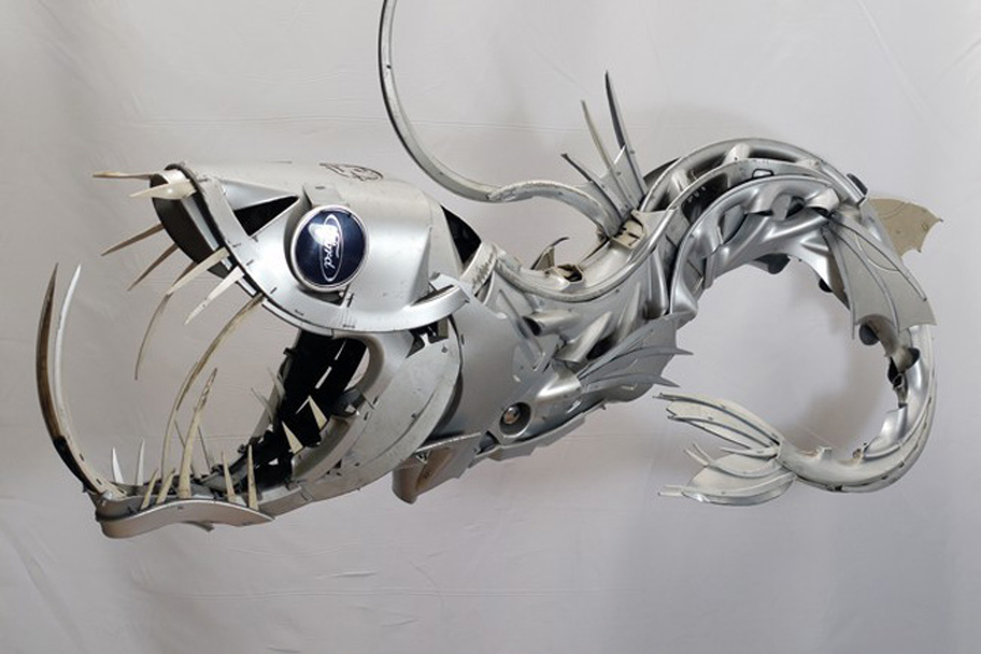 Artist Turns Hubcaps into Amazing Animal Sculptures