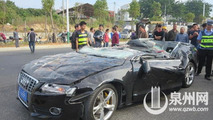 Audi S5 flattened by container