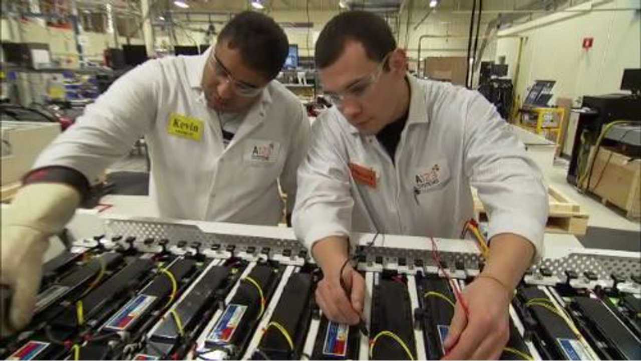 A123 Systems Employees Perform Quality Check On A Lithium Ion Battery Pack