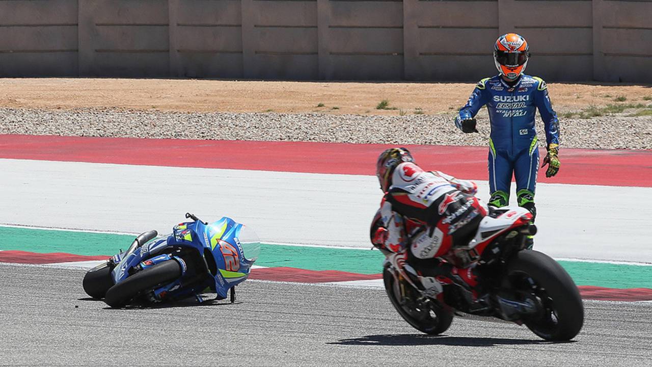 Alex Rins on a Suzuki crashes ten laps in