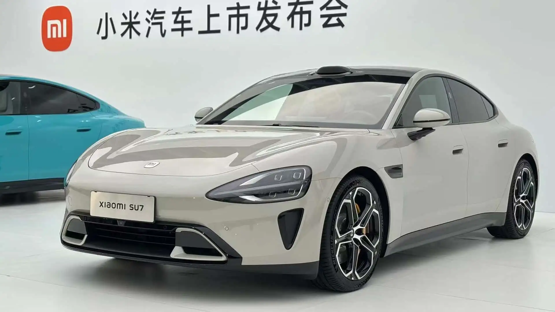 A modern showroom for a Chinese EV brand like Xiaomi Auto. (motor1.com)