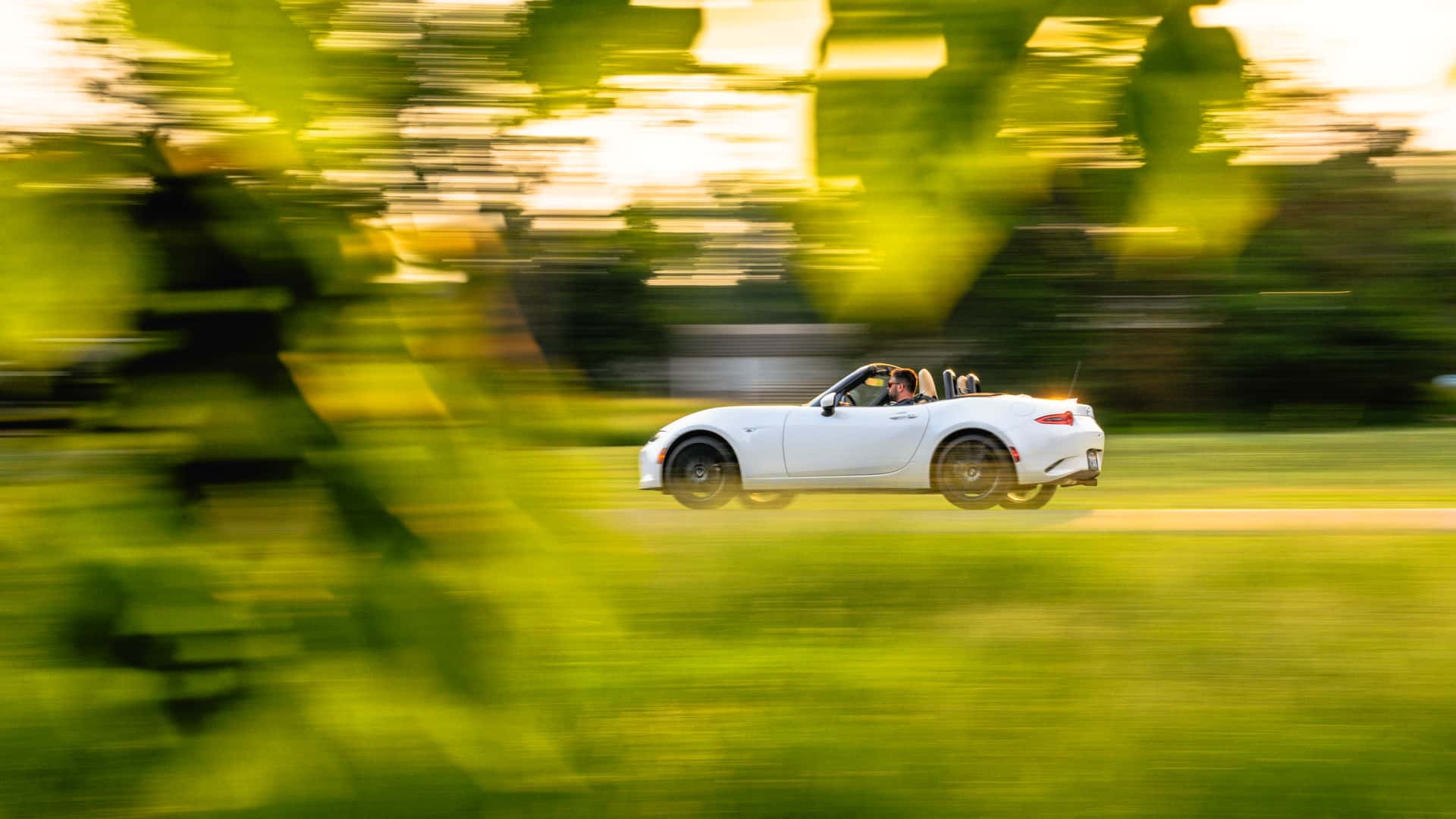 https://cdn.motor1.com/images/mgl/RqYwqP/s1/2024-mazda-mx-5-miata-grand-touring-review.jpg