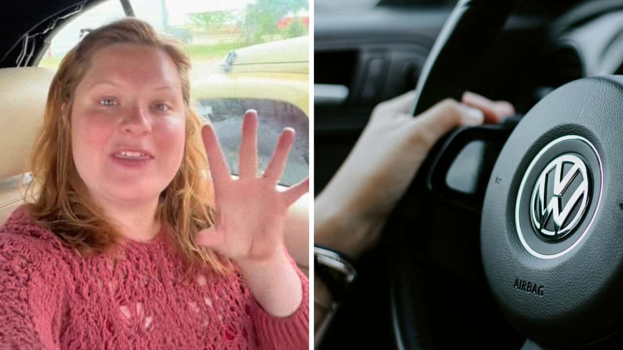 Woman takes Volkswagen Beetle 