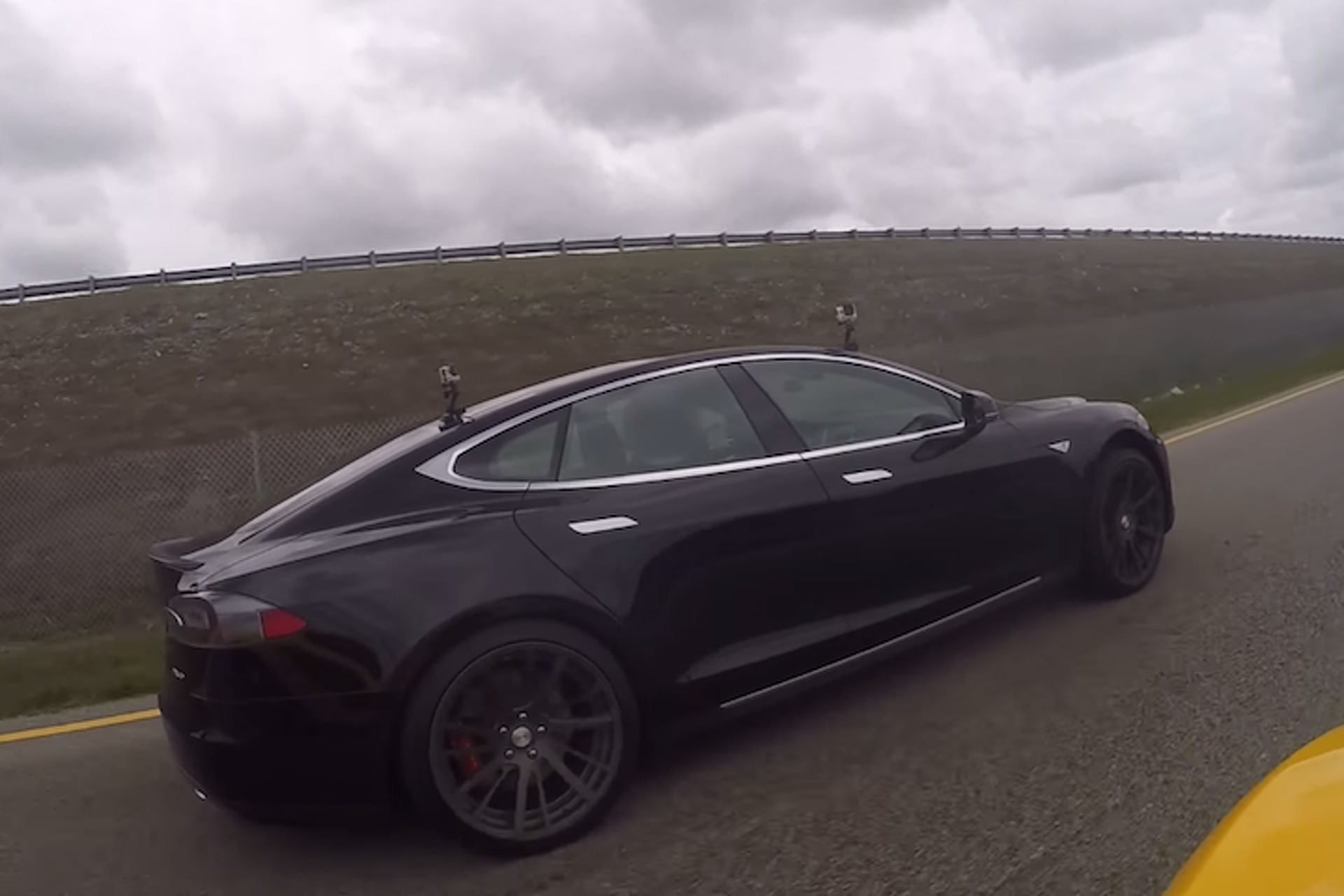 Watch a Tesla P85D Go Up Against a McLaren 650S