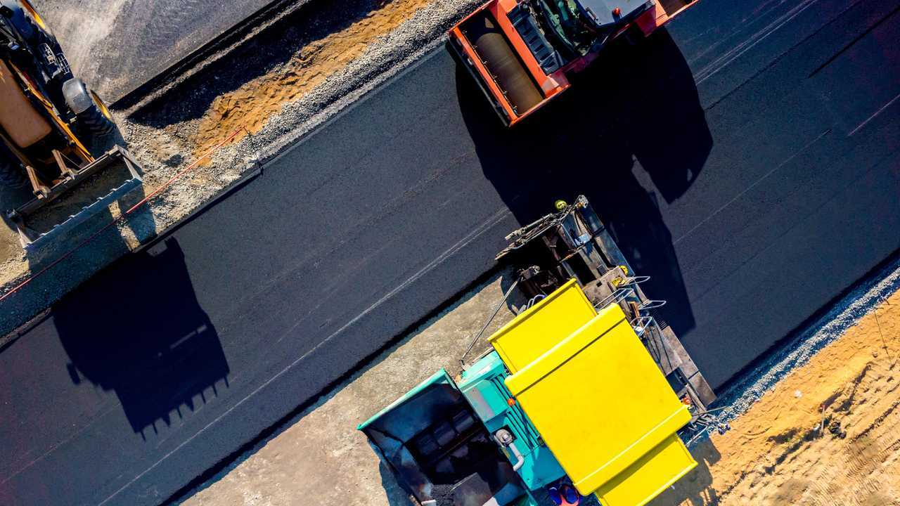 Aerial view on the new asphalt road under construction