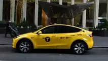 Gravity Tesla Model Y NYC yellow taxi side view