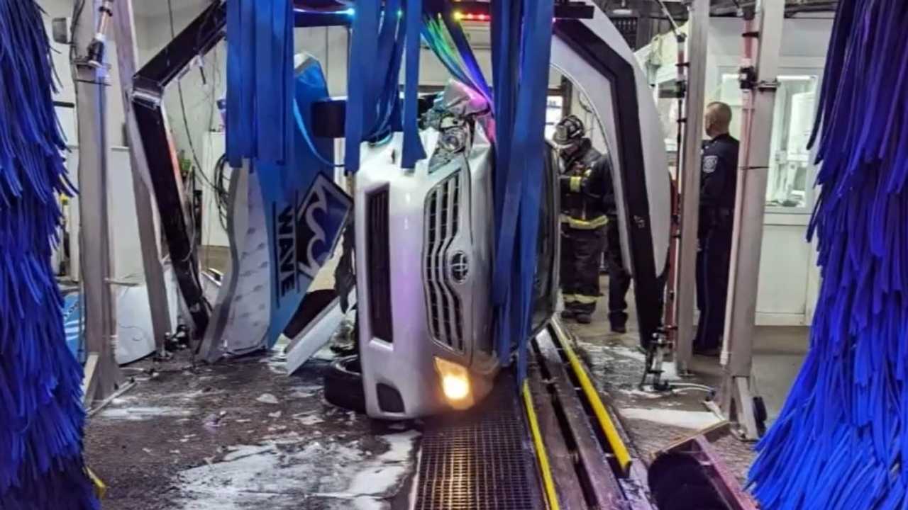 Car flips inside car wash