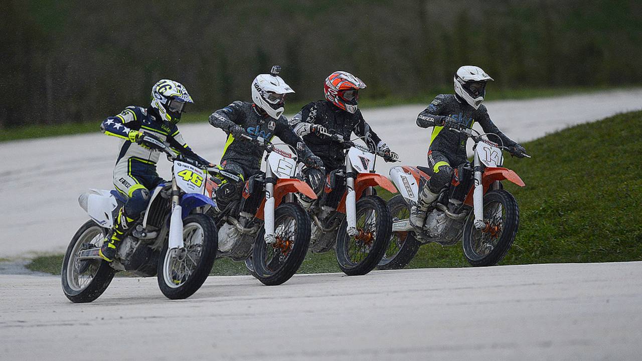 Romano Fenati (second from left) alongside Rossi at the Motor Ranch