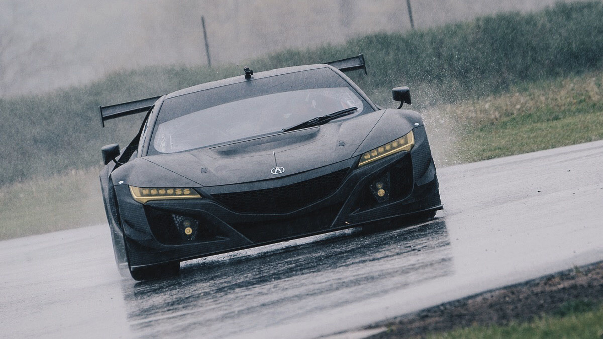 Acura Nsx Gt3 Shows Off Its Carbon Fiber Body On A Wet Track
