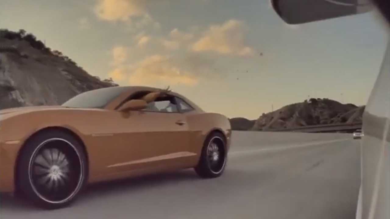 See This Camaro Driver Throw A Bunch Of Coins In a Tesla Model 3