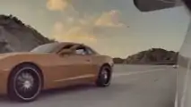 See This Camaro Driver Throw A Bunch Of Coins In a Tesla Model 3