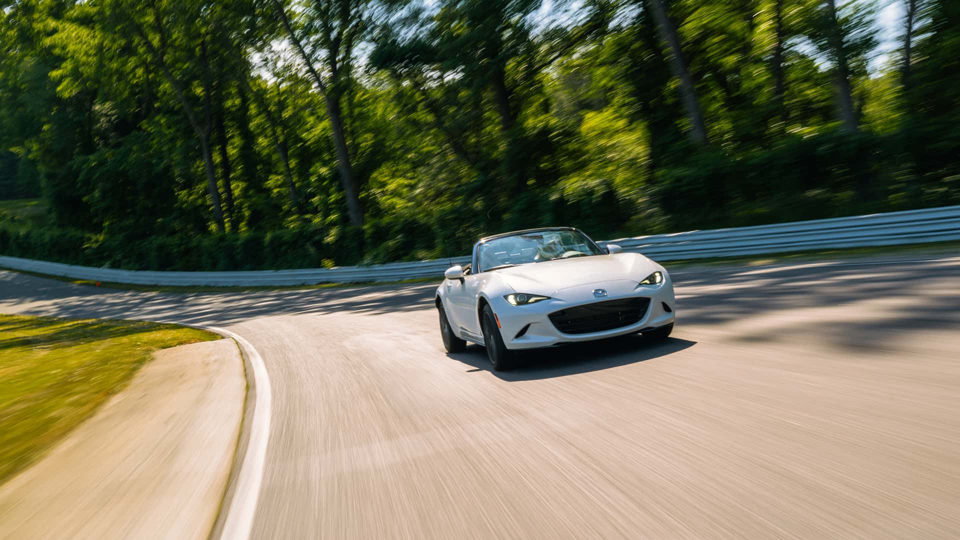 https://cdn.motor1.com/images/mgl/YA3r7r/s1/2024-mazda-mx-5-miata-grand-touring-review.jpg