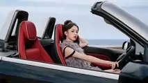 Wuling Hong Guang Mini EV Cabrio close-up with woman at the wheel