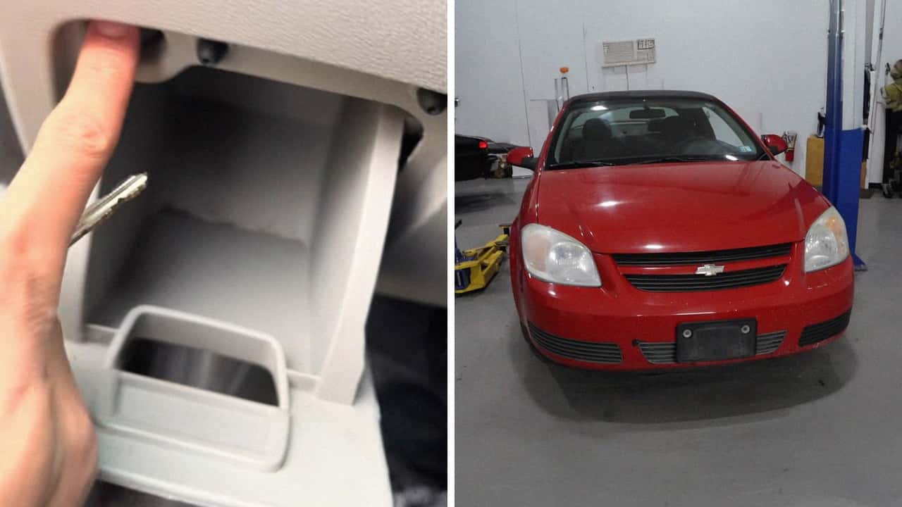 Man changes battery on the Chevrolet Cobalt