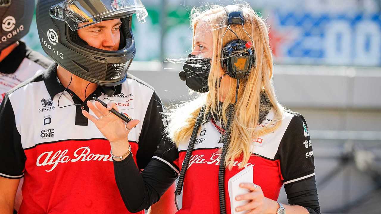 Gemma Fisher with Alfa Romeo Formula 1 team crew member