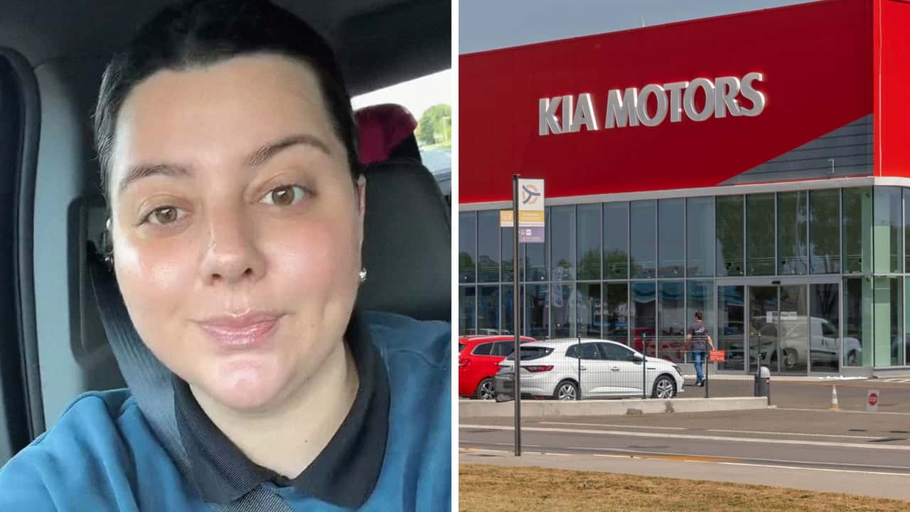 Woman Pays Kia Dealership.jpg