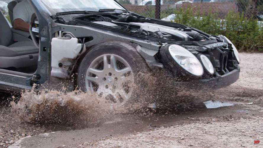 Mercedes-Benz E Class hitting pothole